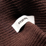 Close-up of Stiksen woven logo label on Brown Beanie 01 merino wool beanie