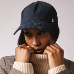 Stiksen 105 Ventile Midnight Blue dad cap worn by female model in soft indoor lighting