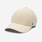 Beige linen baseball cap angled front view showing curved brim and textured fabric