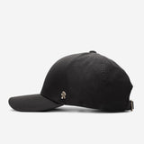 Black Ventile baseball cap side view with curved brim and metal logo detail