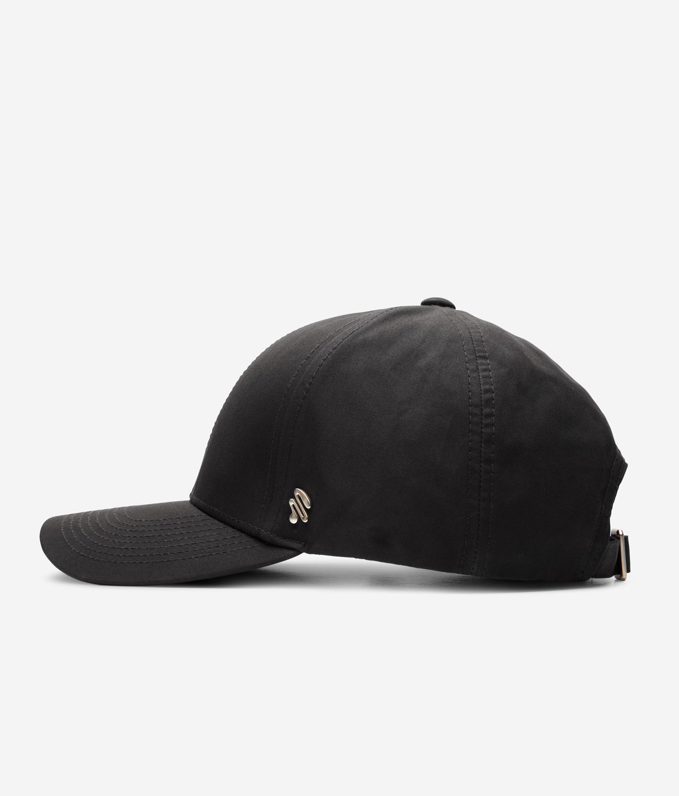 Black Ventile baseball cap side view with curved brim and metal logo detail