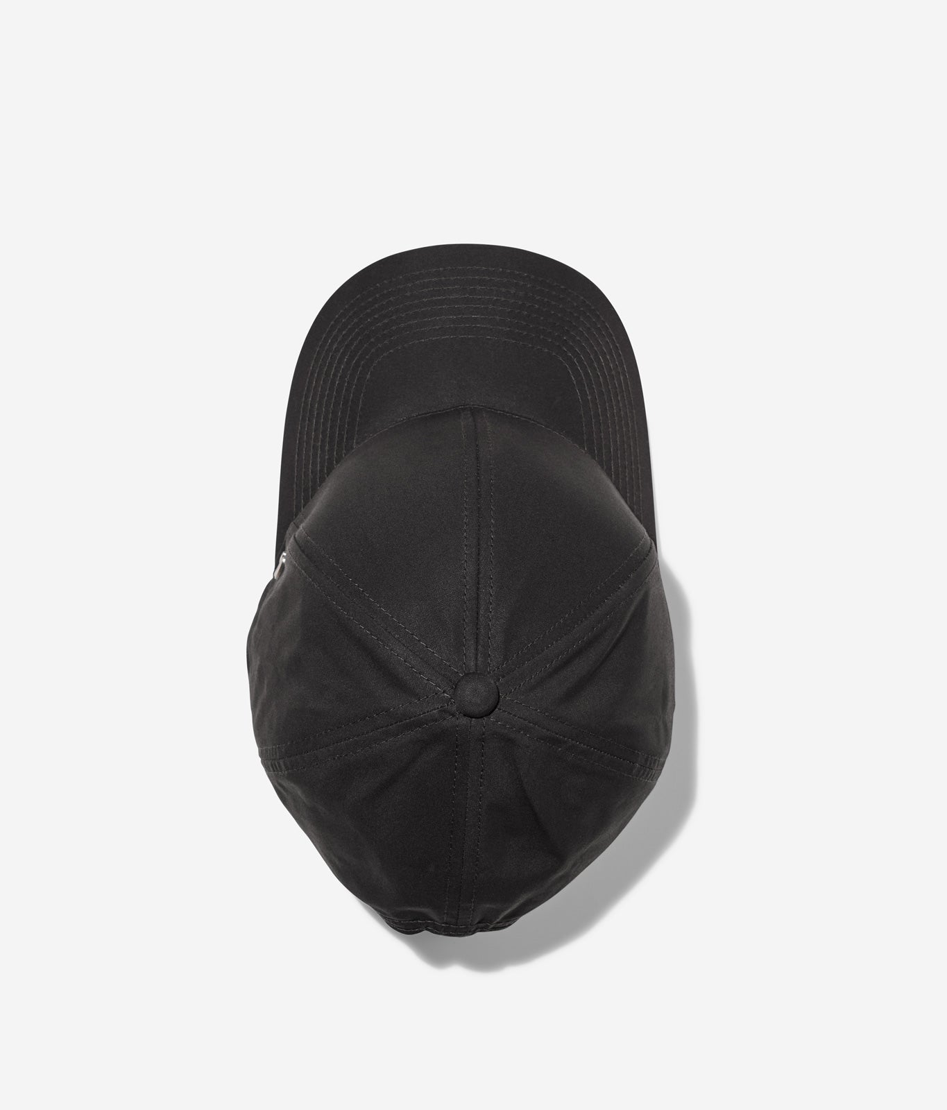 Black Ventile baseball cap top view showing crown construction and stitching details