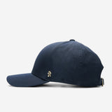 Midnight blue Ventile baseball cap side view with curved brim and metal logo detail