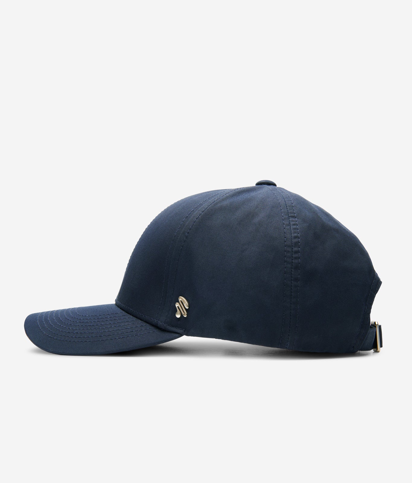 Midnight blue Ventile baseball cap side view with curved brim and metal logo detail