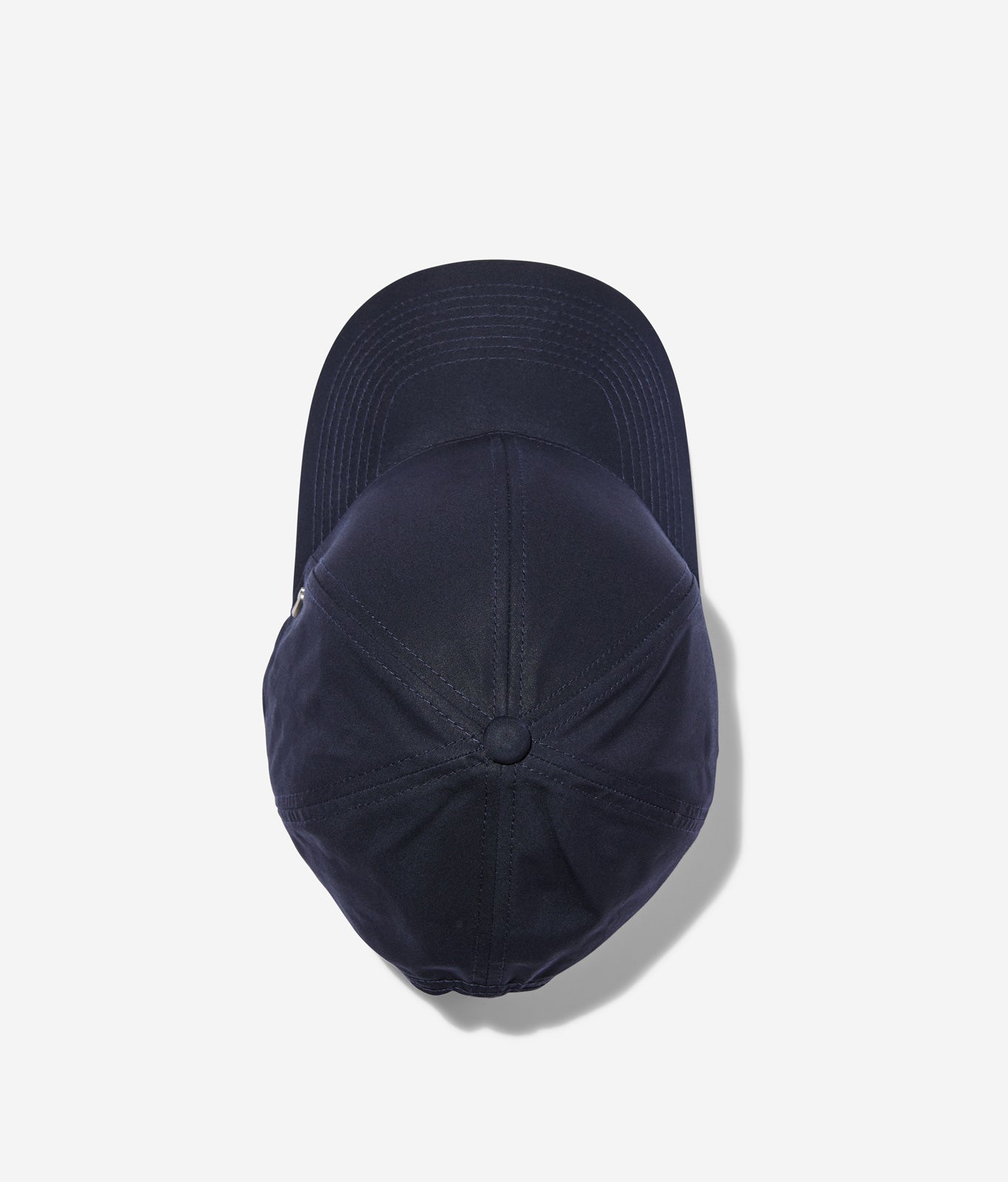 Midnight blue Ventile baseball cap top view showing crown construction and stitching details