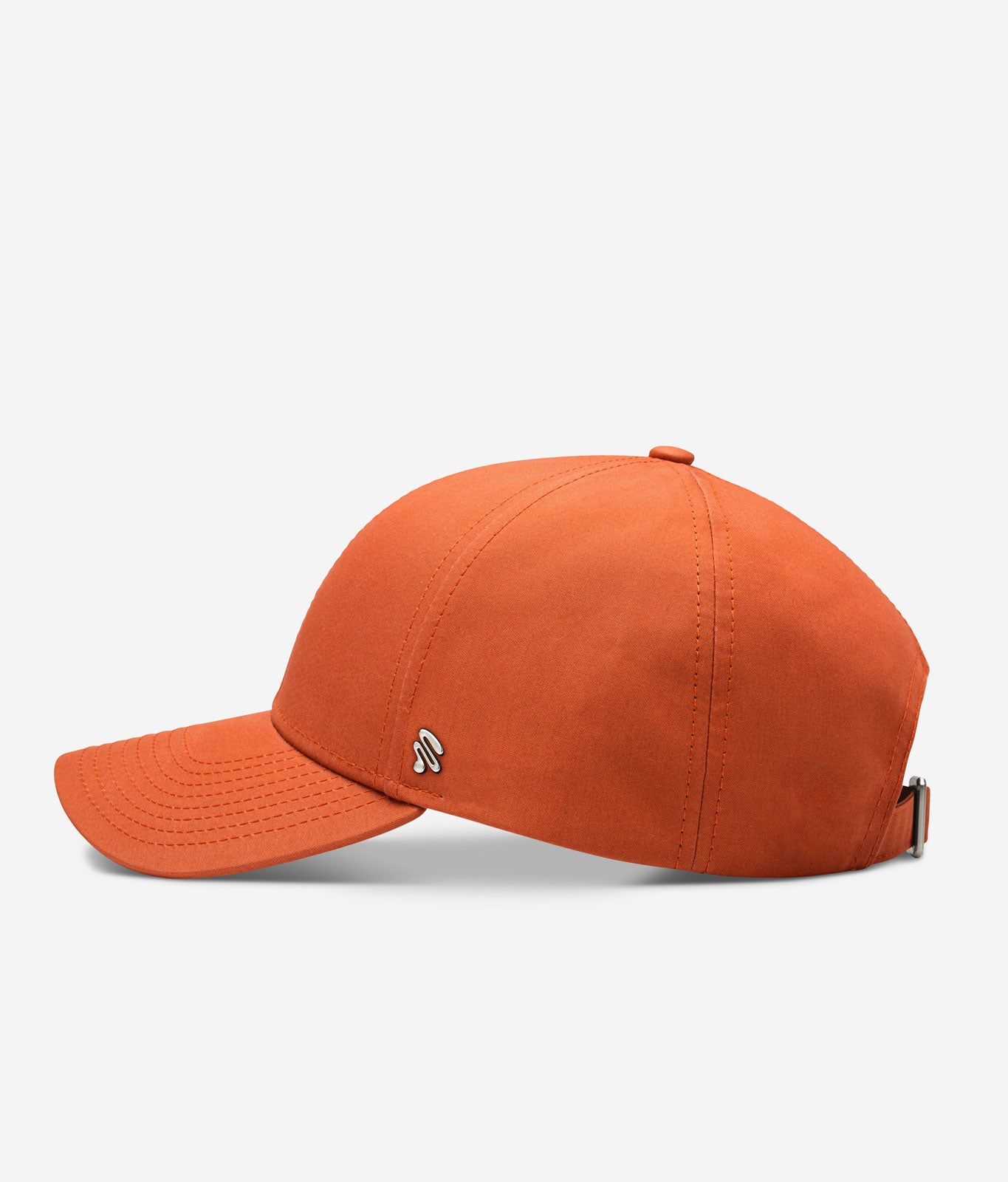 Orange Ventile baseball cap side view with curved brim and metal logo detail