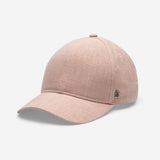 Pink linen baseball cap angled front view showing curved brim and textured fabric