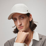 Stiksen 107 Ventile Stone baseball cap worn by model in soft indoor lighting