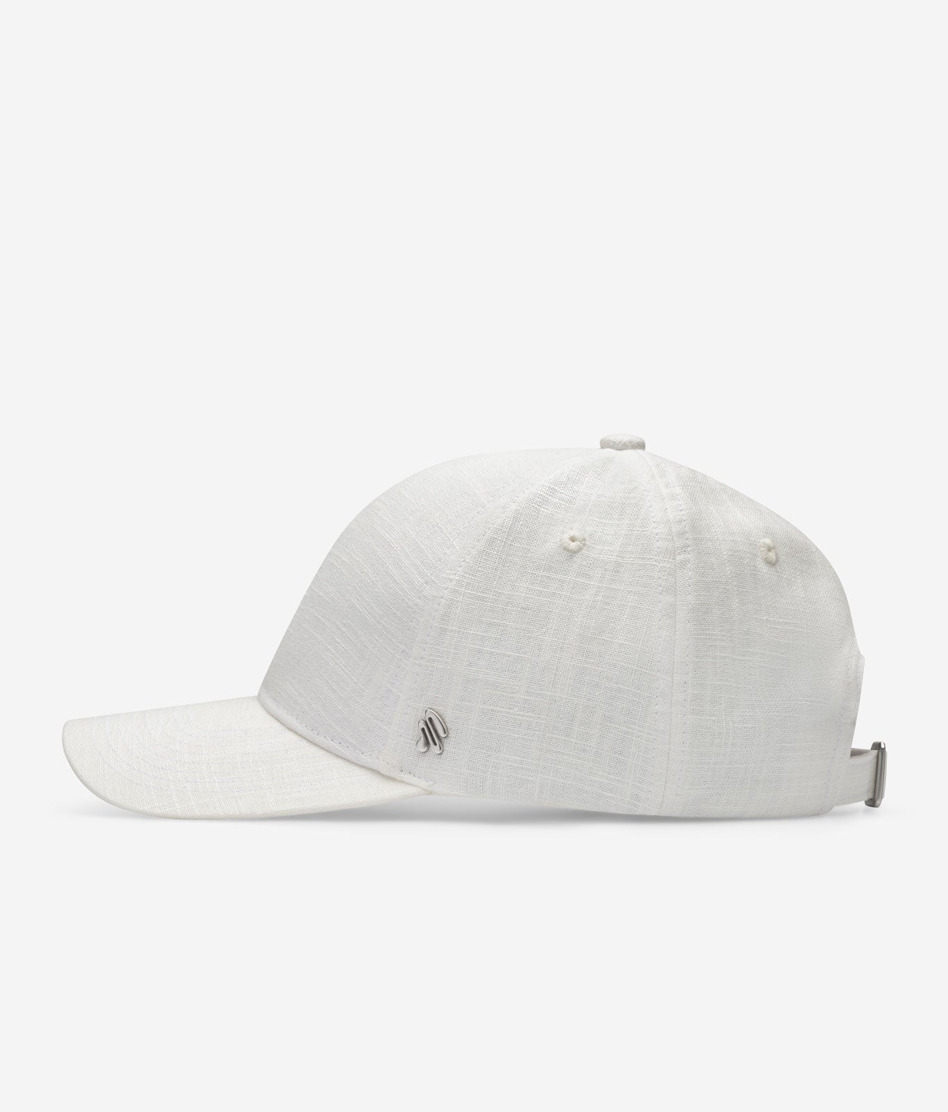 White linen baseball cap side view with curved brim and metal logo detail